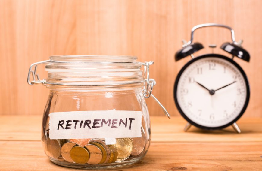 A retirement savings jar with a clock in the background
