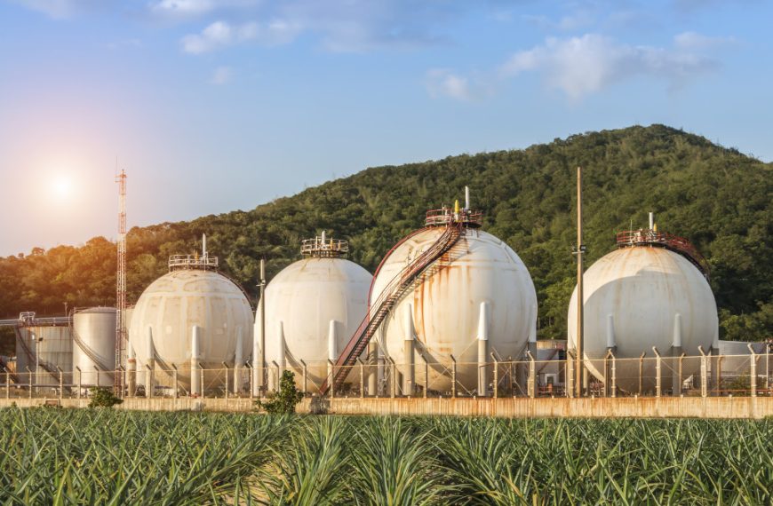 petrochemical factory tanks in a mountainside